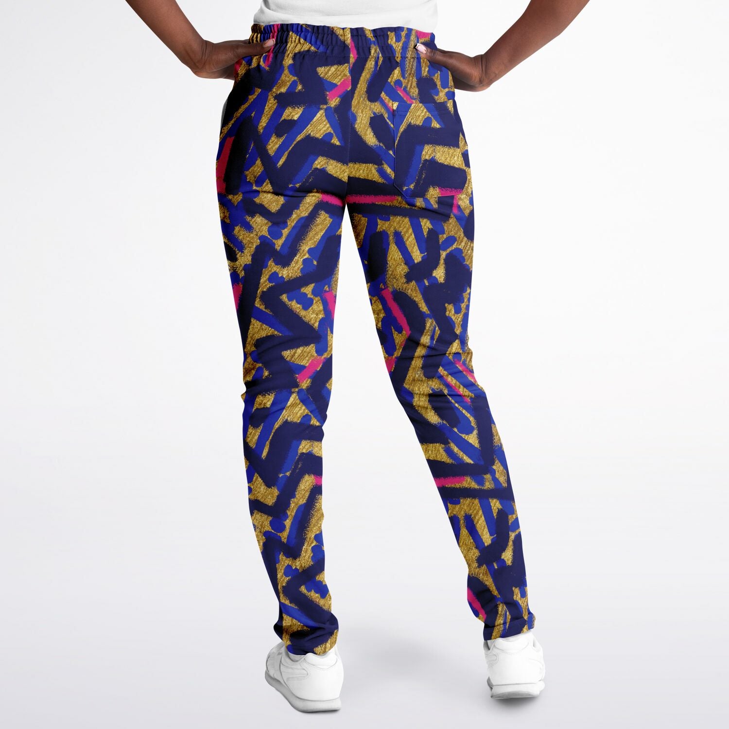 Abstract graffiti print track pants - Blue & Gold  female back view 